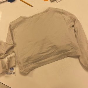 Lululemon long sleeve crop. NWT. Size 12. Color: cream